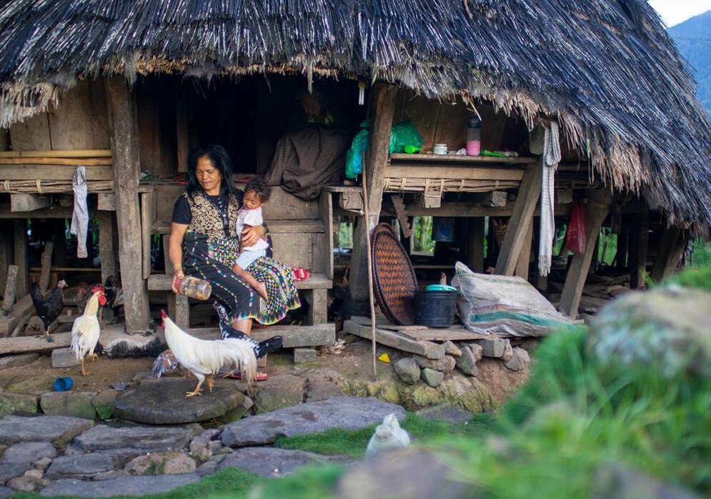 Women with little child in Bena village, Flores Island